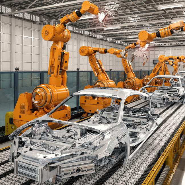 Robotic arms as part of a car assembly line within a manufacturing plant